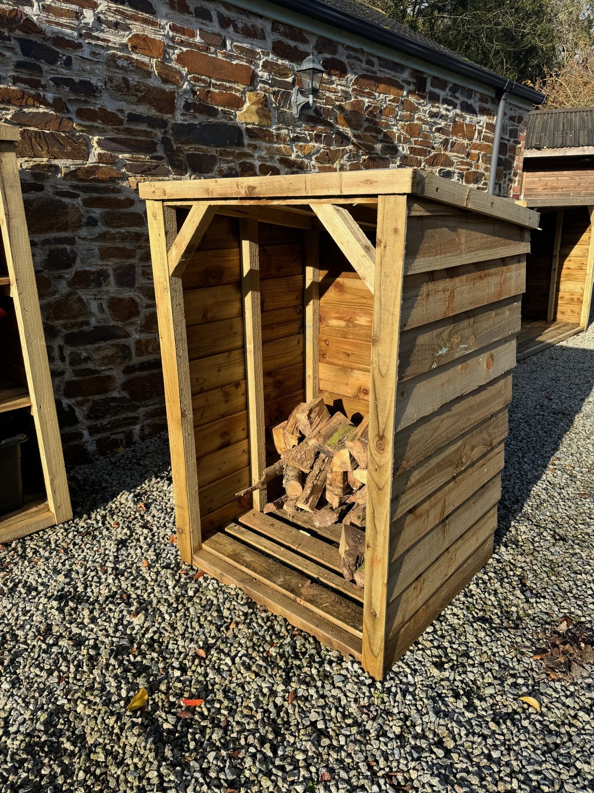 Small Featheredge Log Store — handmade timber